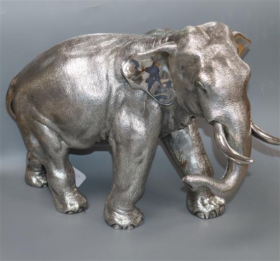 A large filled silver model of an Indian elephant (trunk down), Sheffield 1996, Camelot Silverware, height 25.3cm.